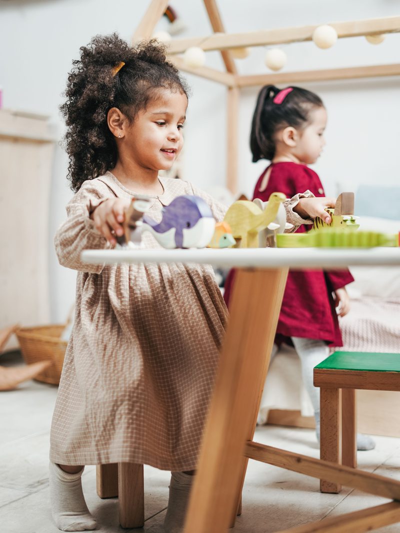 Early years practitioner with children at a nursery