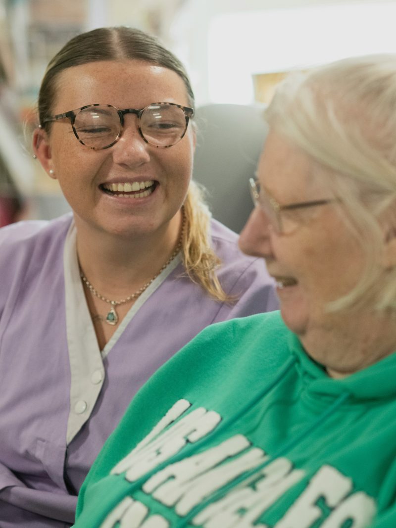 Care assistant supporting a resident